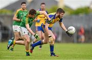 18 May 2014; Cathal Cregg, Roscommon, in action against Paddy Maguire, Leitrim. Connacht GAA Football Senior Championship Quarter-Final, Roscommon v Leitrim, Dr. Hyde Park, Roscommon. Picture credit: Barry Cregg / SPORTSFILE