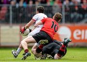 18 May 2014; Mark Donnelly, Tyrone, is fouled by Conor Maginn and goalkeeper Brendan McVeigh, Down, in the square which resulted in a penalty. Ulster GAA Football Senior Championship Preliminary Round, Tyrone v Down, Healy Park, Omagh, Co. Tyrone. Picture credit: Oliver McVeigh / SPORTSFILE