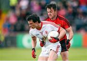 18 May 2014; Aidan McCrory, Tyrone, in action against Mark Poland, Down. Ulster GAA Football Senior Championship Preliminary Round, Tyrone v Down. Healy Park, Omagh, Co. Tyrone. Picture credit: Stephen McCarthy / SPORTSFILE