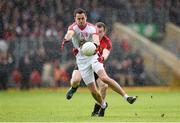 18 May 2014; Kyle Coney, Tyrone, in action against Brendan McArdle, Down. Ulster GAA Football Senior Championship Preliminary Round, Tyrone v Down. Healy Park, Omagh, Co. Tyrone. Picture credit: Stephen McCarthy / SPORTSFILE