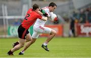 18 May 2014; Kyle Coney, Tyrone, in action against Daniel McCartan, Down. Ulster GAA Football Senior Championship Preliminary Round, Tyrone v Down, Healy Park, Omagh, Co. Tyrone. Picture credit: Oliver McVeigh / SPORTSFILE