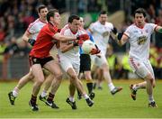 18 May 2014; Kyle Coney, Tyrone, in action against Declan Rooney, Down. Ulster GAA Football Senior Championship Preliminary Round, Tyrone v Down, Healy Park, Omagh, Co. Tyrone. Picture credit: Oliver McVeigh / SPORTSFILE