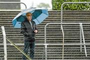 18 May 2014; A supporter watches the game despite the weather conditions. GAA All-Ireland Senior Hurling Championship Qualifier Group - Round 4, Carlow v Westmeath. Dr. Cullen Park, Carlow. Picture credit: Pat Murphy / SPORTSFILE