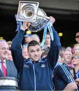 27 April 2014; Paddy Andrews, Dublin, lifts the cup at the end of the game. Allianz Football League Division 1 Final, Dublin v Derry, Croke Park, Dublin.  Picture credit: Ray McManus / SPORTSFILE