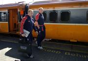 31 March 2006; Munster players Christian Cullen, left, and Mick O'Driscoll on their arrival at Heuston Station for their Heineken Cup Quarter-Final game against Perpignan. Heuston Station, Dublin. Picture credit: Brendan Moran / SPORTSFILE
