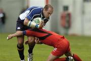 1 April 2006; Keith Gleeson, Leinster, is tackled by Jean Baptiste Elissalde, Toulouse. Heineken Cup 2005-2006, Quarter-Final, Toulouse v Leinster, Le Stadium, Toulouse, France. Picture credit: Matt Browne / SPORTSFILE