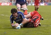 1 April 2006; Shane Horgan, Leinster, scores the fourth try despite the tackle of Cedric Heymans, Toulouse. Heineken Cup 2005-2006, Quarter-Final, Toulouse v Leinster, Le Stadium, Toulouse, France. Picture credit: Matt Browne / SPORTSFILE