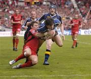1 April 2006; Shane Horgan is tackled by Cedric Heymans, Toulouse. on his way to score the fourth try for Leinster. Heineken Cup 2005-2006, Quarter-Final, Toulouse v Leinster, Le Stadium, Toulouse, France. Picture credit: Matt Browne / SPORTSFILE