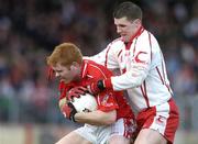 2 April 2006; Sean Levis, Cork, in action against Colin Holmes, Tyrone. Allianz National Football League, Division 1A, Round 3, Tyrone v Cork, Healy Park, Omagh, Co. Tyrone. Picture credit: Brendan Moran / SPORTSFILE