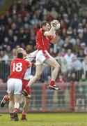 2 April 2006; Graham Canty, Cork, fields a high ball ahead of team-mate Noel O'Leary (18) and Kevin Hughes, Tyrone. Allianz National Football League, Division 1A, Round 3, Tyrone v Cork, Healy Park, Omagh, Co. Tyrone. Picture credit: Brendan Moran / SPORTSFILE
