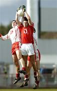 2 April 2006; Derek Kavanagh, Cork, in action against Joe McMahon, left, and Colin Holmes, Tyrone. Allianz National Football League, Division 1A, Round 3, Tyrone v Cork, Healy Park, Omagh, Co. Tyrone. Picture credit: Brendan Moran / SPORTSFILE