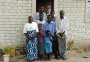 24 March 2006; Galway hurler, Alan Kerins, with the Ilyamubu family outside their new home. The house was funded by the Alan Kerins Zambia Fund. Ilyamubu Compound, Zambia. Picture credit: Damien Eagers / SPORTSFILE