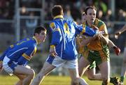 4 April 2006; James Gallagher, Donegal, in action against Barry Gilleran, left, and Cathal Conerfrey. Allianz National Football League, Division 2A, Round 4, Donegal v Longford, Fr. Tierney Park, Ballyshannon, Donegal. Picture credit: Pat Murphy / SPORTSFILE