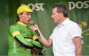18 May 2014; Shane Archbold, An Post Chain Reaction, is  interviewed by MC Cian Lynch after being presented with the points leader jersey after Stage 1 of the 2014 An Post Rás. Dunboyne - Roscommon. Picture credit: Ramsey Cardy / SPORTSFILE