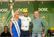 18 May 2014; Christopher Lawless, Great Britain National Team, is presented with the Under 23 jersey by Miss An Post Rás Ruth McCourt, left, and Martin Blige after Stage 1 of the 2014 An Post Rás. Dunboyne - Roscommon. Picture credit: Ramsey Cardy / SPORTSFILE