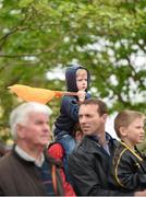18 May 2014; A young spectator waits for the start of the 2014 An Post Rás in Dunboyne. Dunboyne - Roscommon. Picture credit: Ramsey Cardy / SPORTSFILE