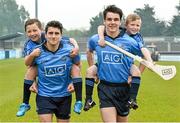 20 May 2014; Dublin GAA stars Bernard Brogan, Danny Sutcliffe, Ciara Ruddy and Ali Twomey helped launch AIG’s jersey promotion at Parnell Park today. AIG is rewarding customers who take out a new car or home insurance policy from www.aig.ie or 1890 27 27 27 with a free kids’ Dublin jersey, or €40 off an adults’ Dublin jersey. The offer runs from May 19th to June 30th.  Vouchers are redeemable on the O’Neills’ website before July 31st. Pictured at the launch are Dublin's Bernard Brogan and Danny Sutcliffe with Shane Delaney, left, and Jason Hartford, both from Scoil Chiarain, Glasnevin, Dublin. Parnell Park, Dublin. Picture credit: David Maher / SPORTSFILE