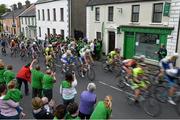 20 May 2014; The peloton passes through Hospital, Co. Limerick, during Stage 3 of the 2014 An Post Rás. Lisdoonvarna - Charleville. Picture credit: Ramsey Cardy / SPORTSFILE
