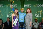 20 May 2014; Sean Lacey, Cork City Aquablue, is presented with the One Direct County jersey by Miss An Post Rás Charleville, Laura Dundon, left, and Joan Kirk, Customer Service Advisor, An Post, after Stage 3 of the 2014 An Post Rás. Lisdoonvarna - Charleville. Picture credit: Ramsey Cardy / SPORTSFILE