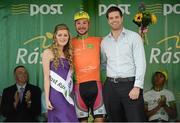 20 May 2014; Jan Sokol, Synergy Baku Cycling, is presented with the LeasePlan stage winner jersey by Miss An Post Rás Charleville Laura Dundon and John-Trevor McVeagh, Corporate Sales Manager, LeasePlan, after Stage 3 of the 2014 An Post Rás. Lisdoonvarna - Charleville. Picture credit: Ramsey Cardy / SPORTSFILE