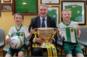 20 May 2014; St. Michael's AFC supporters Shane O'Grady, aged 8, left, and Colin O'Grady, aged 9, along with former Republic of Ireland international Ray Houghton and the FAI Junior Cup during the FAI Junior Cup Aviva Communities Day ahead of Sunday's Final at the Aviva Stadium. St. Michael's AFC Clubhouse, Cooke Park, Tipperary Town. Picture credit: Diarmuid Greene / SPORTSFILE