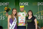 20 May 2014; Alessandro Pettiti, Team IDEA 2010, is presented with the King of the Mountains jersey by Miss An Post Rás Charleville Laura Dundon, left, and Elizabeth Cremin, Cremin Cycles, after Stage 3 of the 2014 An Post Rás. Lisdoonvarna - Charleville. Picture credit: Ramsey Cardy / SPORTSFILE