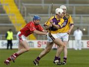 2 April 2006; Declan Ruth, Wexford, in action against Ciaran McGann, Cork. Allianz National Hurling League, Division 1A, Round 4, Wexford v Cork, Wexford Park, Wexford. Picture credit: Pat Murphy / SPORTSFILE