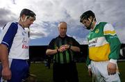 9 April 2006; Referee Pat O'Connor checks his watch with Waterford captain Paul Flynn, right and Offaly captain Brendan Murphy for the start of the game, fifteen minutes later than the sechule time. Allianz National Hurling League, Division 1A, Round 5, Offaly v Waterford, St. Brendan's Park, Birr, Co. Offaly. Picture credit: David Maher / SPORTSFILE