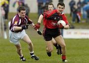 9 April 2006; Daniel Hughes, Down, in action against Declan Meehan, Galway. Allianz National Football League, Division 1B, Round 7, Down v Galway, St Patricks Park, Newcastle, Co. Down. Picture credit: Damien Eagers / SPORTSFILE