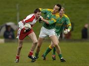 9 April 2006; Enda Muldoon, Derry, in action against Anthony Moyles, Meath. Allianz National Football League, Division 1B, Round 7, Meath v Derry, Pairc Tailteann, Navan, Co. Meath. Picture credit: Pat Murphy / SPORTSFILE
