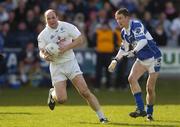 9 April 2006; John Divilly, Kildare, in action against Gary Kavanagh, Laois. Allianz National Football League, Division 1B, Round 7, Laois v Kildare, O'Moore Park, Portlaoise, Co. Laois. Picture credit: Brian Lawless / SPORTSFILE