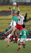 9 April 2006; Ronan McGarrity, Mayo, wins an aerial ball ahead of Kevin Hughes, Tyrone. Allianz National Football League, Division 1A, Round 7, Mayo v Tyrone, McHale Park, Castlebar, Co. Mayo. Picture credit: Oliver McVeigh / SPORTSFILE