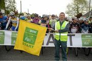21 May 2014; Local Charleville postman John Harnett gets Stage 4 of the 2014 An Post Rás underway. Charleville - Cahirciveen. Picture credit: Ramsey Cardy / SPORTSFILE