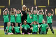 22 May 2014; Irish Long Jump record holder Kelly Proper and Christine Whelan, Forest Feast Sales Manager Ireland, with children who took part in the launch of the Forest Feast Athletics Summer Camp. Morton Stadium, Santry, Dublin. Picture credit: Matt Browne / SPORTSFILE