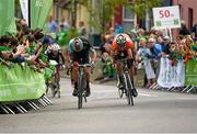 22 May 2014; Ian Bibby, Madison Genisis, left, leads eventual stage winner, Marcin Bialoblocki, Velosure Giordana, with 30 metres to go during Stage 5 of the 2014 An Post Rás. Cahirciveen - Clonakilty. Picture credit: Ramsey Cardy / SPORTSFILE