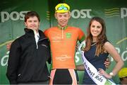 22 May 2014; Marcin Bialoblocki, Velosure Giordana, is presented with the stage winners jersey by Miss An Post Rás Clonakilty Emma O'Sullivan, and John Inglis, Senior Technical Manager, LeasePlan, after Stage 5 of the 2014 An Post Rás. Cahirciveen - Clonakilty. Picture credit: Ramsey Cardy / SPORTSFILE