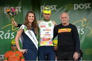 22 May 2014; Alessandro Pettiti, Team IDEA 2010, is presented with the King of the Mountains jersey by Miss An Post Rás Clonakilty Emma O'Sullivan and Michael Murphy, MTM Cycles, after Stage 5 of the 2014 An Post Rás. Cahirciveen - Clonakilty. Picture credit: Ramsey Cardy / SPORTSFILE