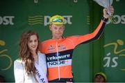 21 May 2014; Marcin Bialoblocki, Velosure Giordana, is presented with the stage winners jersey by Miss An Post Rás, Lauren O'Sullivan after Stage 4 of the 2014 An Post Rás. Charleville - Cahirciveen. Picture credit: Ramsey Cardy / SPORTSFILE