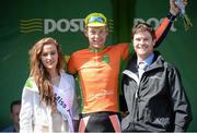 21 May 2014; Marcin Bialoblocki, Velosure Giordana, is presented with the stage winners jersey by Miss An Post Rás, Lauren O'Sullivan, left, and John Inglis, Senior Technical Manager, LeasePlan, after Stage 4 of the 2014 An Post Rás. Charleville - Cahirciveen. Picture credit: Ramsey Cardy / SPORTSFILE