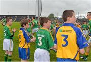 18 May 2014; Children from the Cumann na mBunscoil exhibition games form a guard of honour for both teams before the game. Connacht GAA Football Senior Championship Quarter-Final, Roscommon v Leitrim, Dr. Hyde Park, Roscommon. Picture credit: Piaras Ó Mídheach / SPORTSFILE