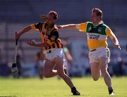 11 July 1999; Andy Comerford of Kilkenny in action against Daithi Regan of Offaly during the Leinster Senior Hurling Championship Final match between Kilkenny and Offaly at Croke Park in Dublin. Photo by Ray McManus/Sportsfile