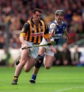 20 June 1999; Brian McEvoy of Kilkenny in action against Paul Cuddy of Laois during the Guinness Leinster Senior Hurling Championship Semi-Final match between Kilkenny and Laois at Croke Park in Dublin. Photo by Ray McManus/Sportsfile