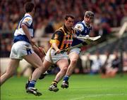20 June 1999; Brian McEvoy of Kilkenny in action against Paul Cuddy, right, and Andy Bergin of Laois during the Guinness Leinster Senior Hurling Championship Semi-Final match between Kilkenny and Laois at Croke Park in Dublin. Photo by Ray McManus/Sportsfile