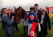 27 June 1999; Jockey Cash Asmussen, trainer John Hammond and winning connections celebrate after sending out Montjeu to win the 1999 Budweiser Irish Derby at The Curragh Racecourse in Newbridge, Kildare. Photo by Damien Eagers/Sportsfile