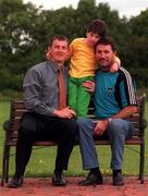 21 June 1999; Ciara Duff, aged 5, with her Dad Ciaran Duff, right, and her Godfather and former Dublin captain, John O'Leary pictured at her home in Swords, Dublin. Photo by David Maher/Sportsfile
