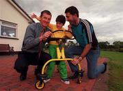 21 June 1999; Ciara Duff, aged 5, with her Dad Ciaran Duff, right, and her Godfather and former Dublin captain, John O'Leary pictured at her home in Swords, Dublin. Photo by David Maher/Sportsfile