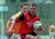 20 June 1999; Ciaran Byrne of Down in action against Kevin Madden of Antrim during the Bank of Ireland Ulster Senior Football Championship Quarter-Final match between Down and Antrim at Pairc Esler in Newry, Down. Photo by David Maher/Sportsfile