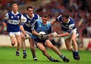 27 June 1999; Ciaran Whelan of Dublin is tackled by George Doyle, left, and Kevin Fitzpatrick of Laois during the Leinster Senior Football Championship Semi-Final match between Dublin and Laois at Croke Park in Dublin. Photo by Brendan Moran/Sportsfile