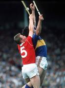 16 July 1990. Sean McCarthy of Cork in action against Joe Hayes of Tipperary during the Munster Senior Hurling Championship Final match between Tipperary and Cork at Semple Stadium in Thurles, Tipperary. Photo by Ray McManus/Sportsfile