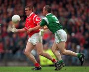 20 June 1999; Damien O'Neill of Cork in action against Diarmuid Sheehy of Limerick during the Munster Senior Football Championship Semi-Final match between Cork and Limerick at Páirc Uí Rinn in Cork. Photo by Brendan Moran/Sportsfile